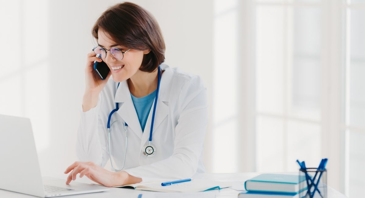 Doctor talking on the phone about how to stop losing coolsculpting customers.