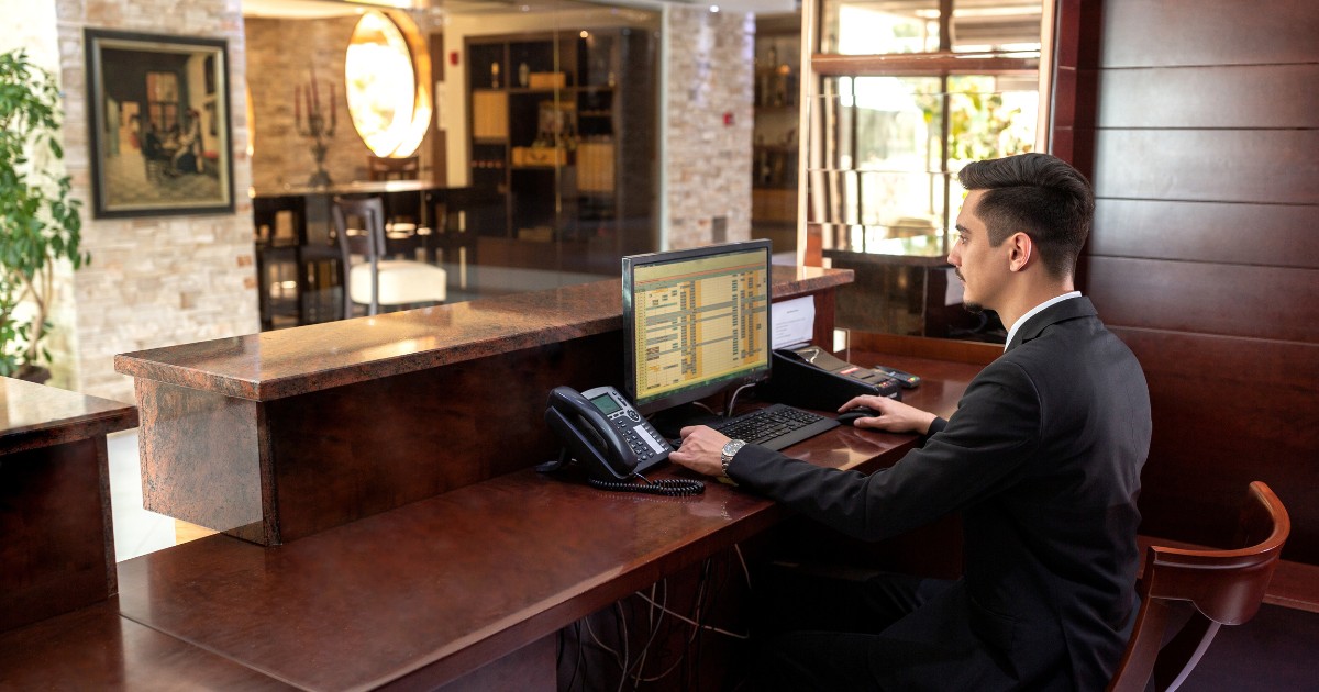 a front desk worker sitting alone