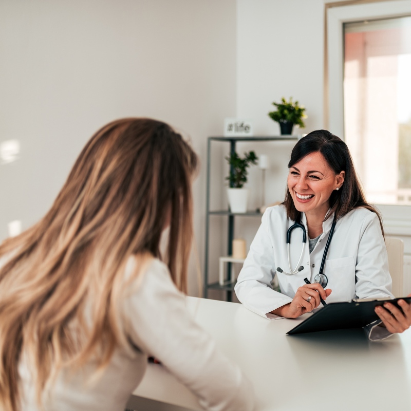 a provider smiling while talking to a customer