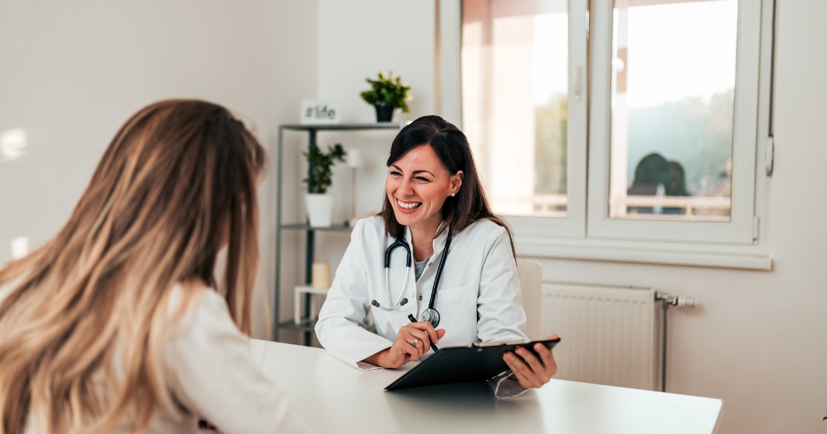 a provider smiling while talking to a customer