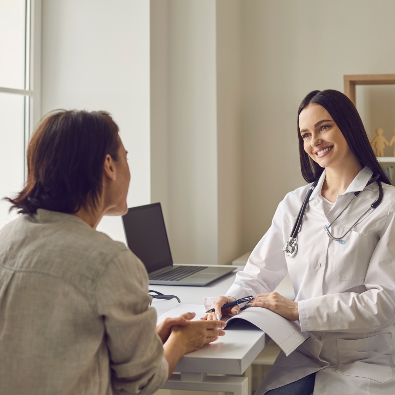 a provider talking to a customer and smiling
