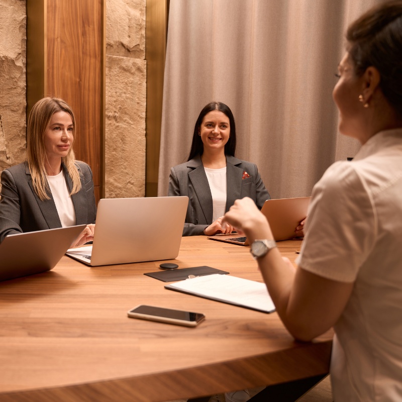 a provider talking with their team of front desk workers