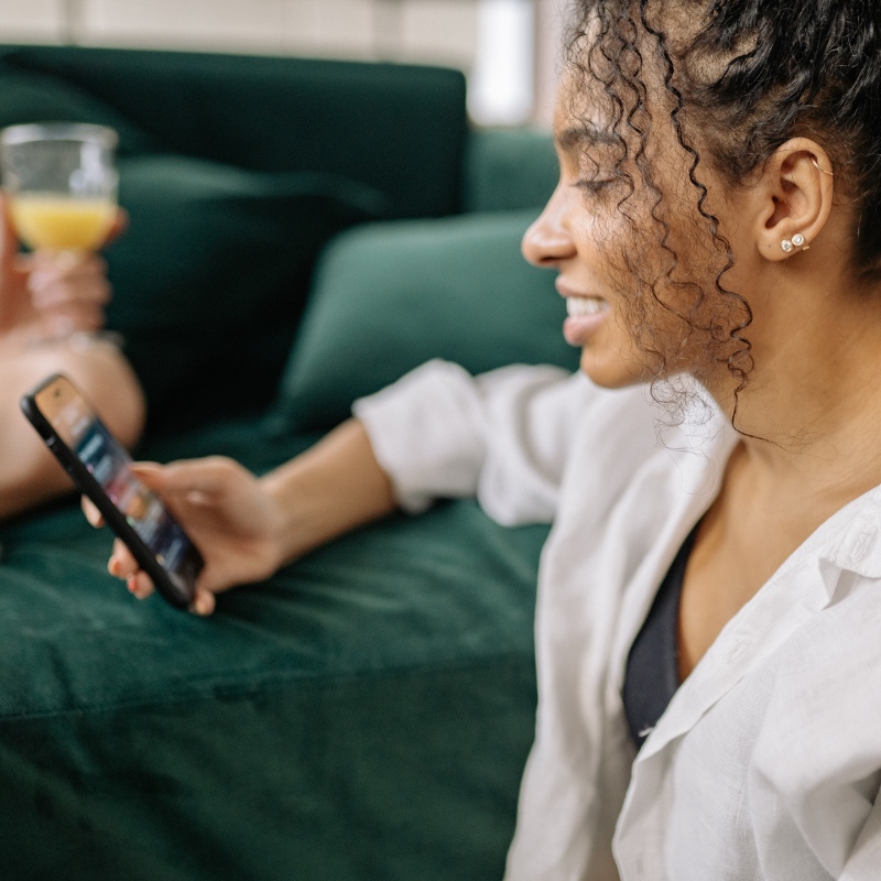 An image of a woman searching for something on her phone