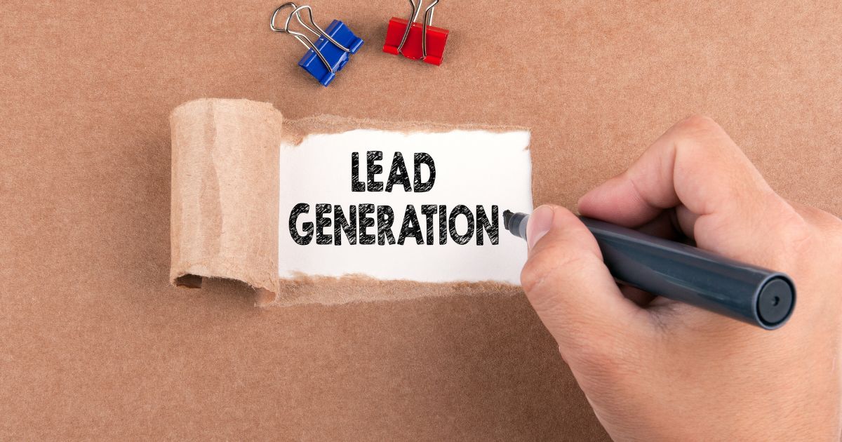Hand writing “Lead Generation” on a note.