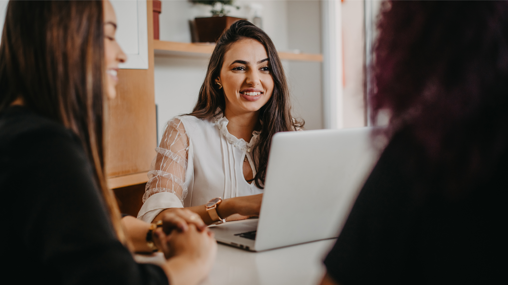 Woman discussing marketing strategy during a business meeting.