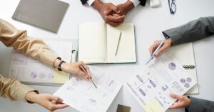 Marketing professionals reviewing SEO costs and performance reports.